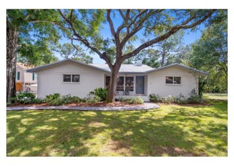 Great Buy on a Charming renovated white brick, waterfront Gulf Shores Home